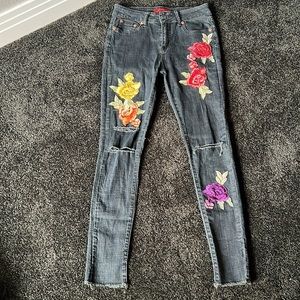 Rose embroidered black skinny jeans